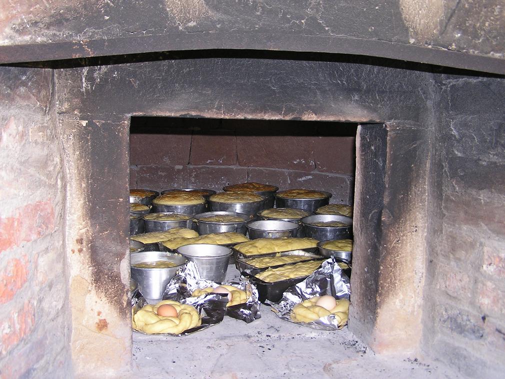 Cooking the Torta di Pasqua in the woodden oven.