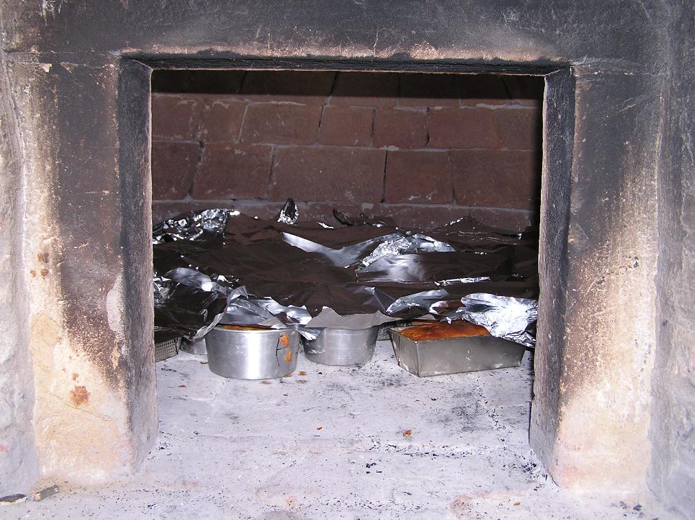 Cooking the Torta di Pasqua in the woodden oven.